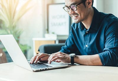 Man using a laptop.