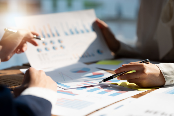 Reviewing charts to tackle small business financial challenges.