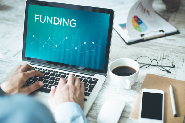 business funding tips laptop graphs | Maximizing Your Business Funding: Tips and Tricks